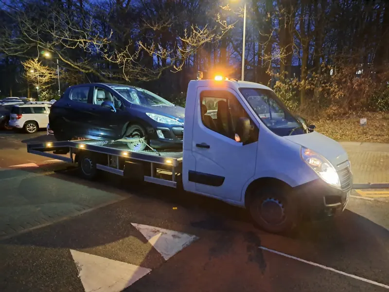 Scrap car bought and loaded onto a recovery truck in Cumbria